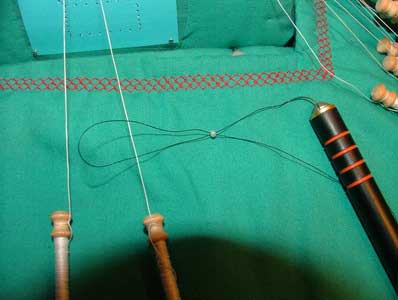 put first bobbin through the loop and transfer the bead over 